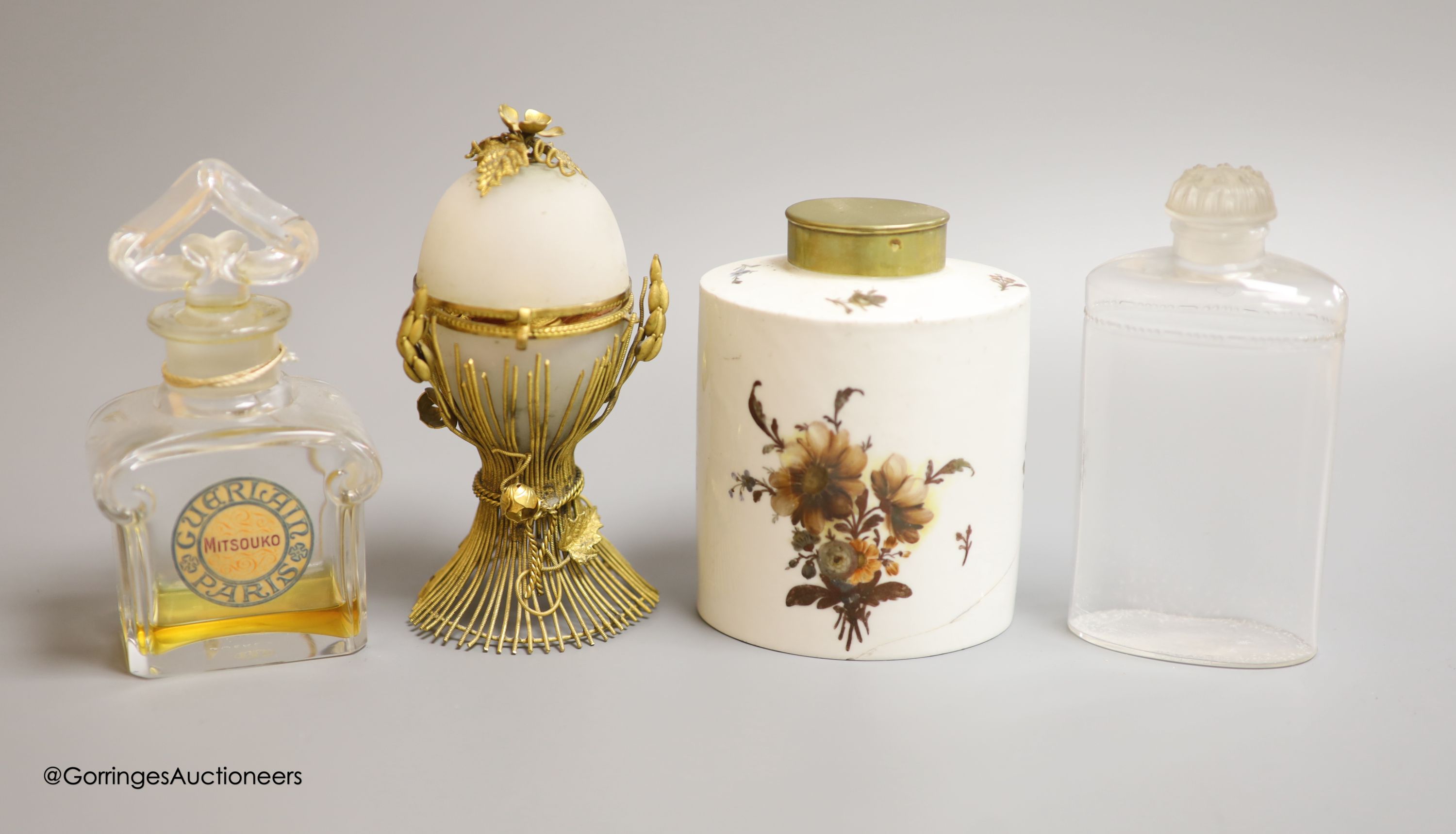A gilt metal necessaire, a ceramic continental perfume bottle and a Guerlain and Coty perfume bottle